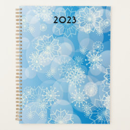 Agenda Navidades con copos de nieve en un fondo azul