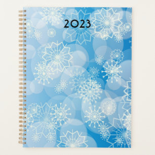 Agenda Navidades con copos de nieve en un fondo azul
