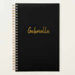 Agenda Negro y oro personalizado<br><div class="desc">Un planificador negro y dorado personalizado. Podrá personalizar fácilmente la cubierta frontal con un nombre en oro. La cubierta trasera es negra sólida. Por favor vea todas las fotos. Este planificador personalizado también le haría un regalo único.</div>