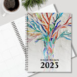 Agenda Nombre personalizado de 2023<br><div class="desc">Este único Planner está decorado con un árbol de colores vivos. El diseño original se hizo en mosaico usando pequeños trozos de vidrio. Personalizar con tu nombre y año. Para seguir editando, utilice la Herramienta de diseño para cambiar el tipo de letra, el tamaño de la fuente o el color....</div>