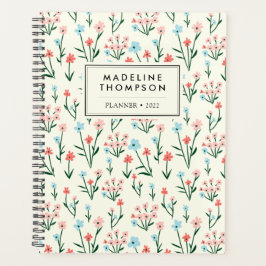 Agenda Patrón simple de flores azules rosadas en pasto