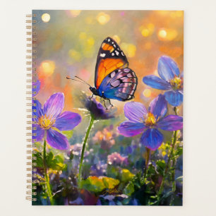 Agenda Pequeña mariposa en flores silvestres al amanecer