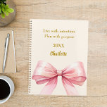 Agenda Pink bow beige cream quote 2026<br><div class="desc">A soft beige,  cream colored background,  decorated with a large pink bow.  Quote: Live with intention.  Plan with purpose.</div>