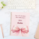 Agenda Pink bow quote 2026<br><div class="desc">A soft blush pink background,  decorated with a large bow.  Quote: Live with intention.  Plan with purpose.</div>