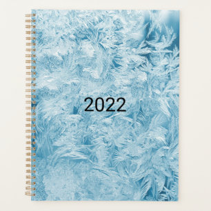 Agenda plumas azules abstractas y copos de nieve