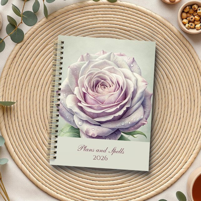 Agenda Rosa encantado de la luna (Enchanted Moonlit Rose Planner on a boho table with botanicals and a cup of tea.)