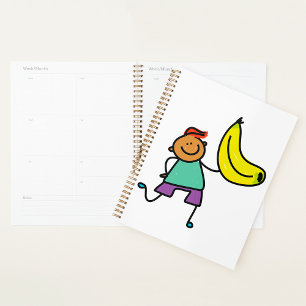 Agenda Un niño juguetón sostiene un gran plátano amarillo