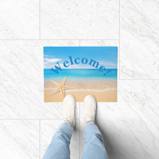 Alfombra de bienvenida personalizada en la playa