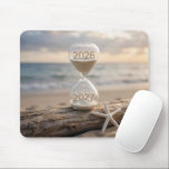 Alfombrilla De Ratón New Year 2027 Hourglass on Driftwood Log<br><div class="desc">A sand timer sits on a weathered driftwood log by the beach,  showing the years 2026 and 2027,  next to a white starfish,  as a serene ocean and sky stretch out in the background</div>
