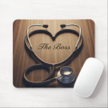 Alfombrilla De Ratón Nurse Manager Gift Stethoscope Heart Wood Grain<br><div class="desc">Nurse Manager Gift Stethoscope Heart Wood Grain Show your passion for leadership and care with "The Boss" medical-themed mouse pad. This high-quality design features a professional stethoscope elegantly shaped into a heart, framing the words "The Boss" etched onto a warm, realistic wood grain background. It is the perfect desk accessory...</div>