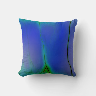 almohada abstracta de rayos verdes y azules
