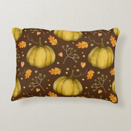 Almohada acentuada de calabazas doradas