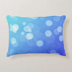 Almohada azul con diseño de gradiente abstracto