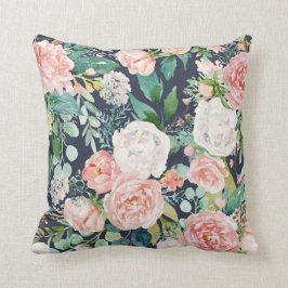 Almohada azul marina con flores rosas y blancas