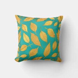 Almohada azul verde con hojas doradas