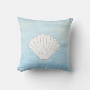 Almohada azul y blanca de almejas