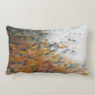 Almohada blanca anaranjada verde azulada de la
