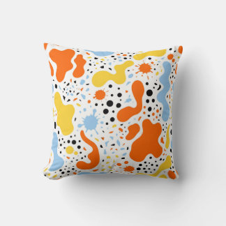 Almohada colorida con manchas abstractas y salpica