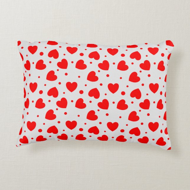 Almohada con corazones rojos sobre fondo blanco (Reverso)