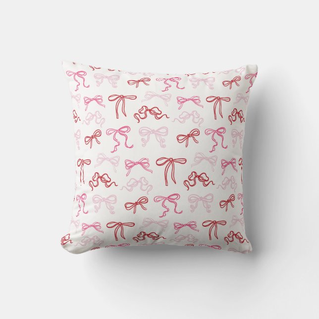 Almohada con estampado de lazos coquette rosados y (Anverso)