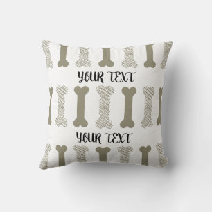Almohada con huesos garabateados lindos