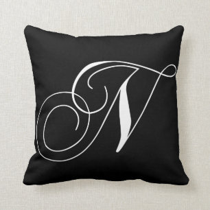 Almohada con monograma del diseñador blanco negro