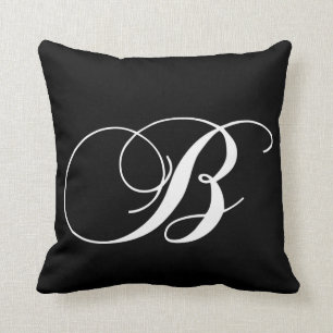 Almohada con monograma del diseñador blanco negro