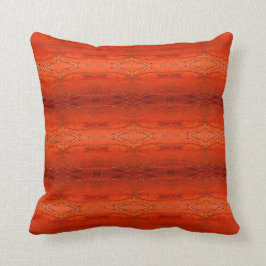 Almohada con patrón azteca naranja rústica