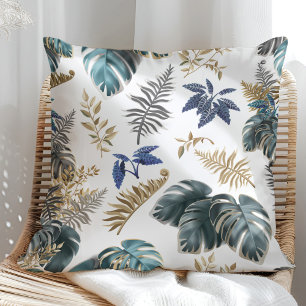 Almohada con patrón de hojas azul tropical y dorad