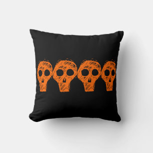 almohada de Halloween de cráneo naranja y negro