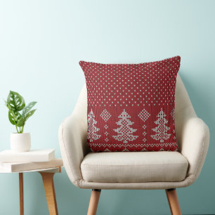 Almohada de Navidad con árboles rojos y copos de n
