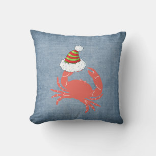 Almohada de Navidad de cangrejo sosteniendo sombre