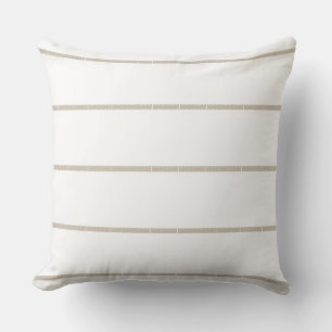 Almohada de rayas blancas y neutras