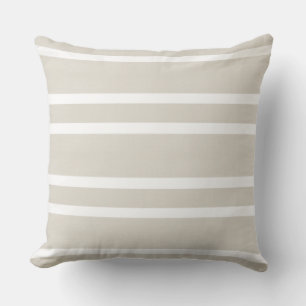 Almohada de rayas blancas y neutros cálidos