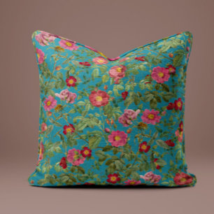 Almohada de rosa rosa vintage en azul pavo real