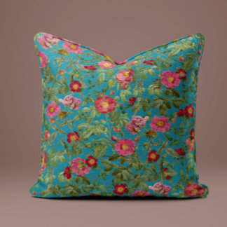 Almohada de rosa rosa vintage en azul pavo real