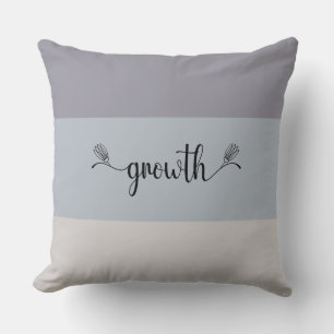 Almohada de tirar con escritura de "Crecimiento" a