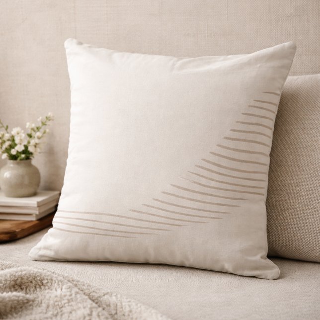 Almohada de tirar de líneas fluidas taupe (Asymmetrical taupe lines introduce gentle movement to balanced, neutral interiors.)