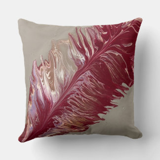 Almohada de tiro de pluma abstracta en rojos