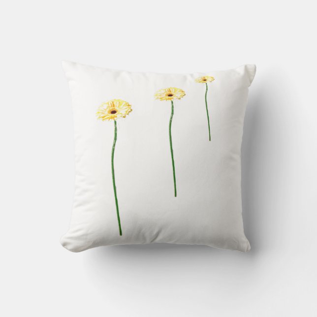 Almohada de tres flores de gerbera amarillas (Anverso)