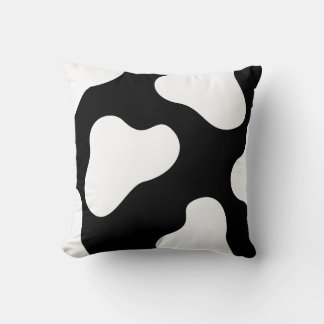 almohada de vaca negra y blanca