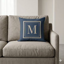 Almohada decorativa con monograma enmarcado en azu