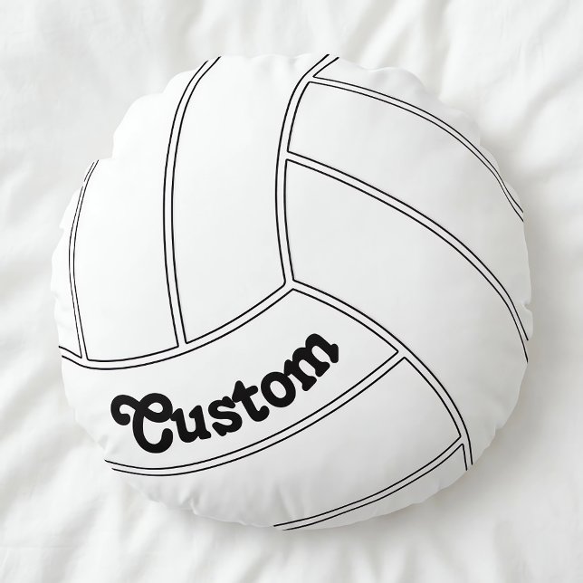 Almohada decorativa redonda personalizada de volei (Customizable round volleyball pillow on white duvet.)
