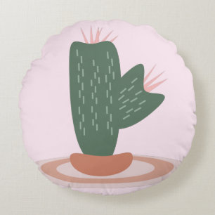 Almohada decorativa rosa con cactus espinoso sobre