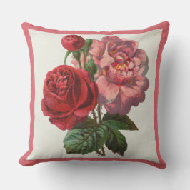Almohada del patio rosada y rosas rojos florales