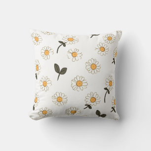almohada floral blanca con centro amarillo