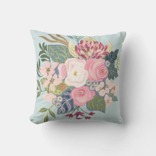 Almohada floral con fondo azul claro