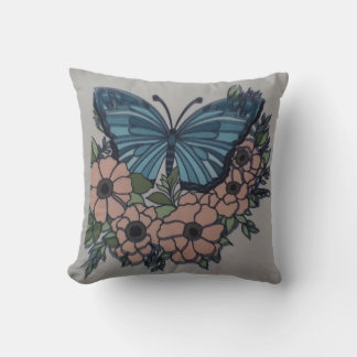 Almohada floral de crema de mariposa azul para mam