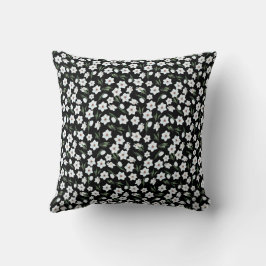 almohada floral negra con flores blancas