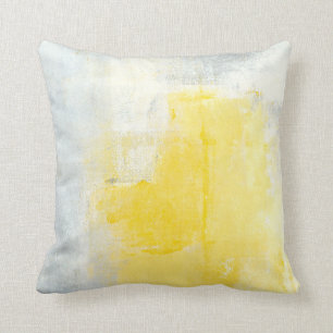 Almohada gris y amarilla de la "canalización